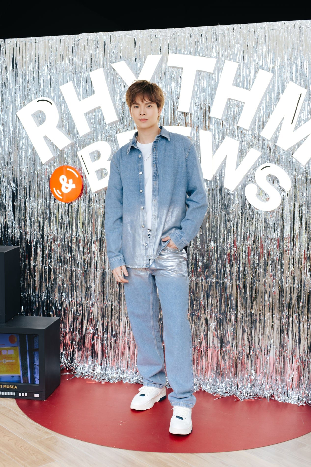 Moon Tang standing in front of a silver K11 MUSEA event backdrop