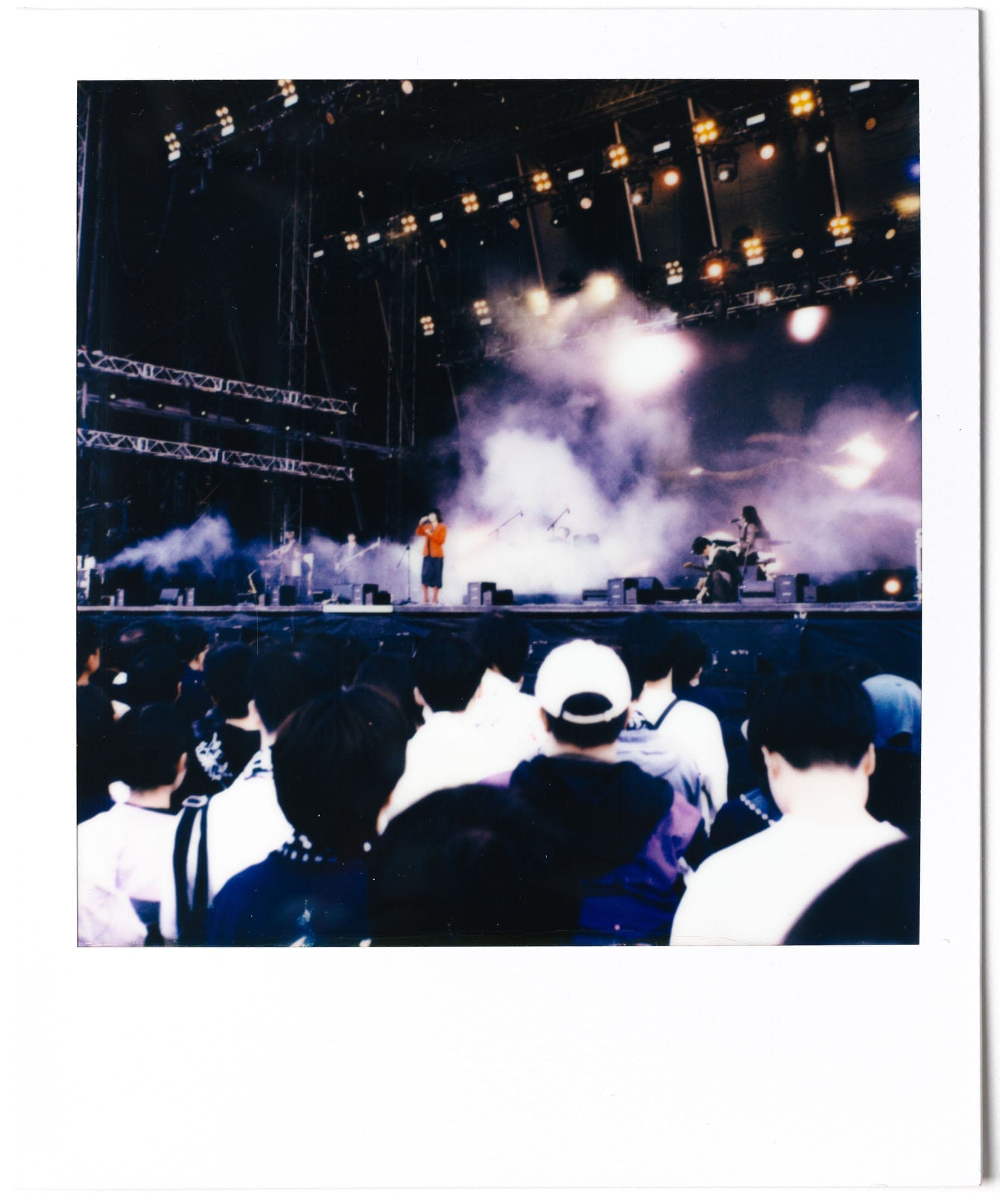 Stage smoke and crowd at Clockenflap on Polaroid film