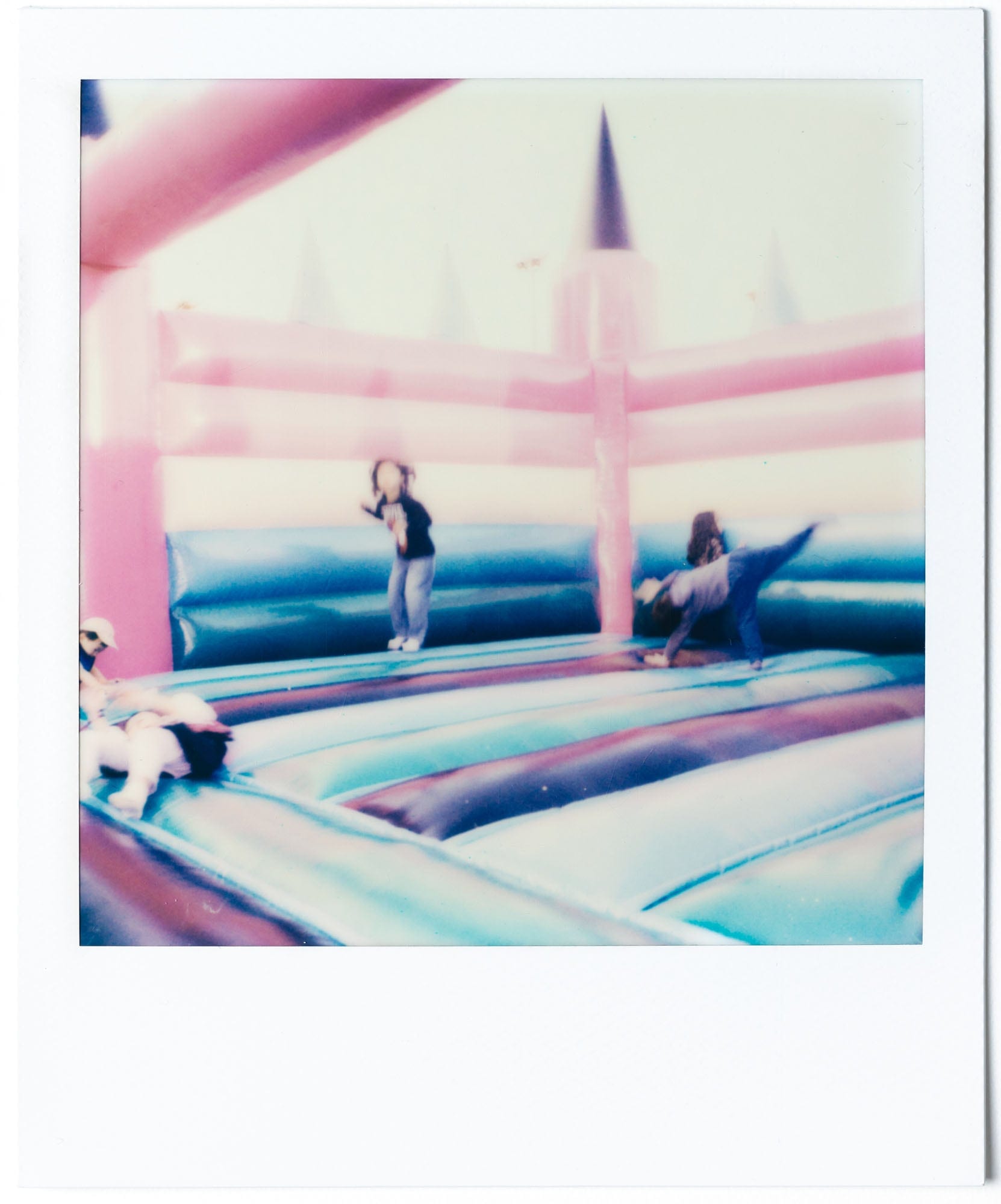 Colorful inflatable scene at Clockenflap on Polaroid film