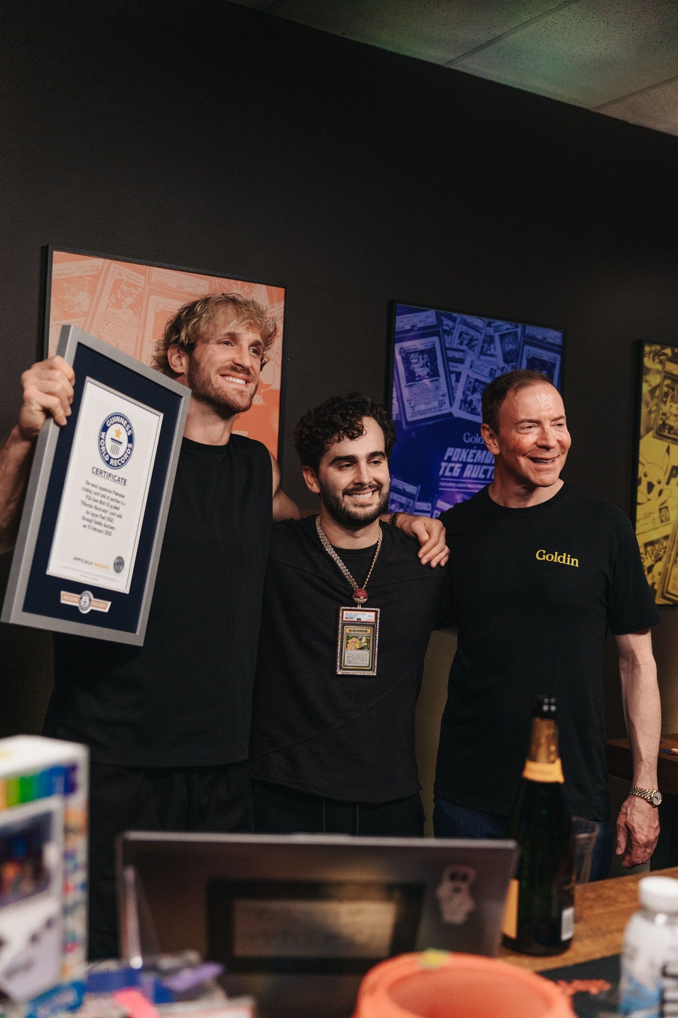 Logan Paul and guests holding the Guinness World Records certificate at the Goldin event