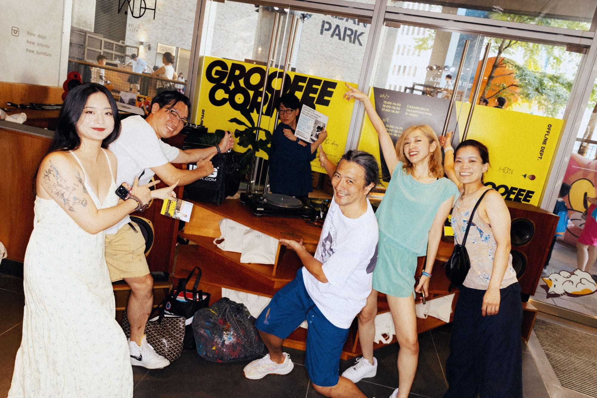 Guests gathered around the DJ booth at Grooffee Corner