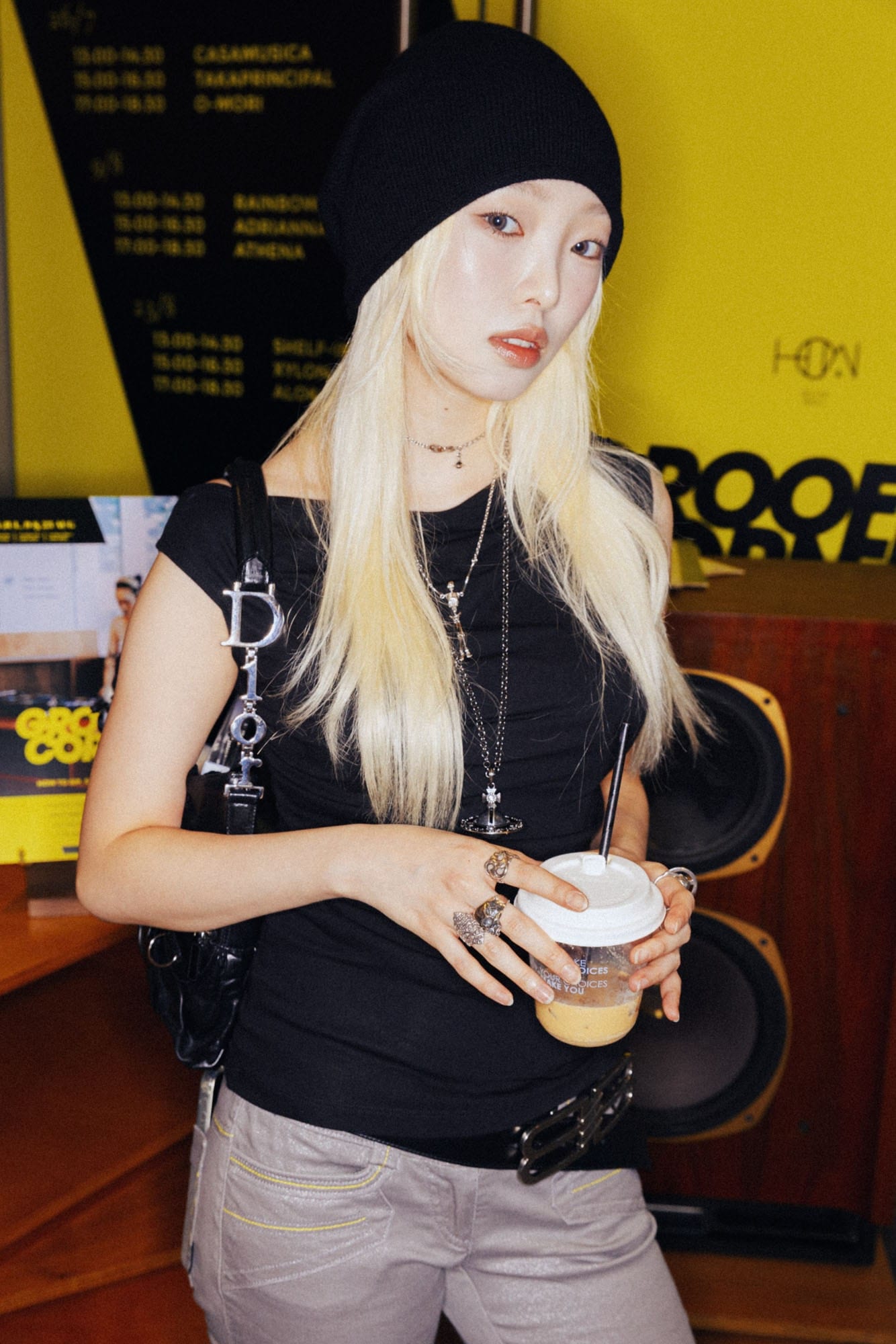 Guest holding a coffee at the Grooffee Corner event