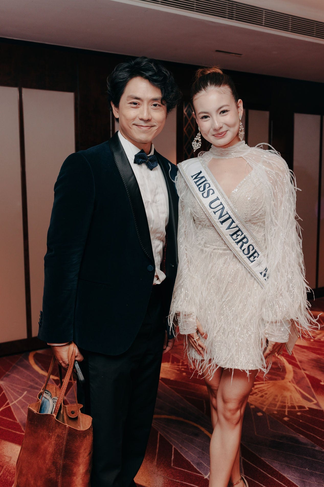 Cassandra posing with a guest at the evening event