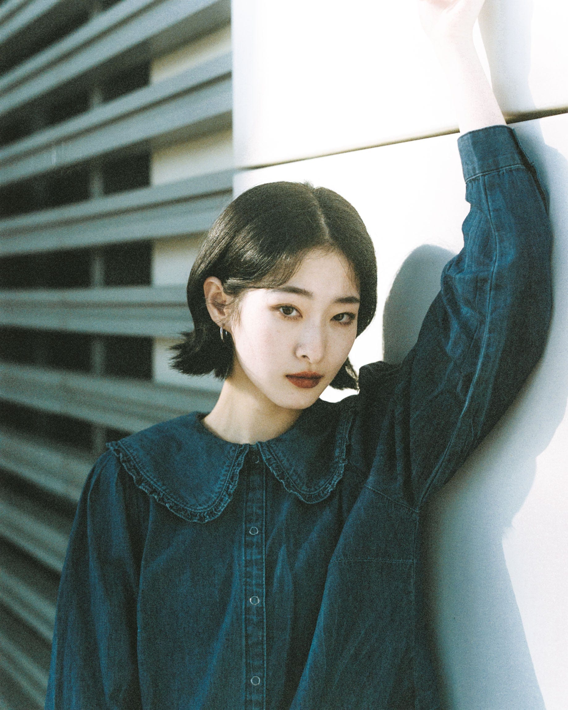 Portrait in a dark denim dress