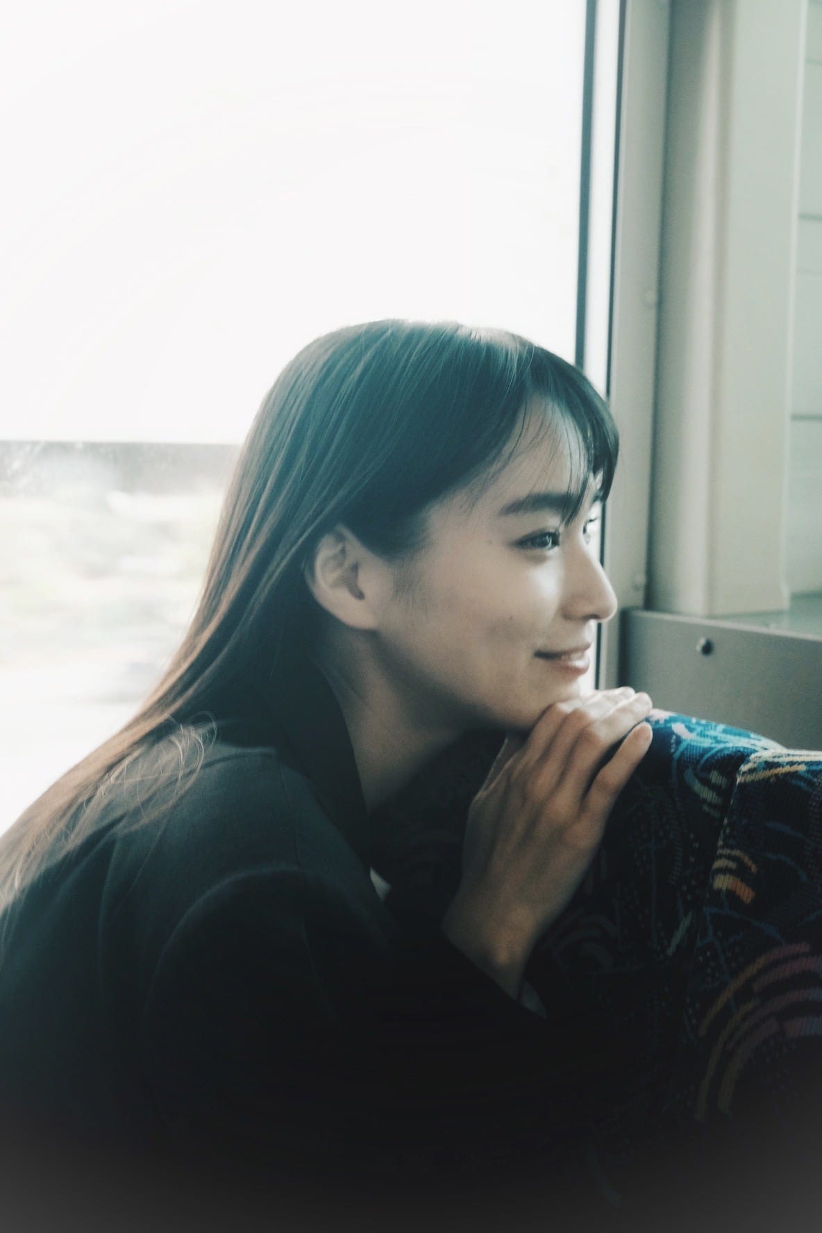 Intimate portrait beside a train window
