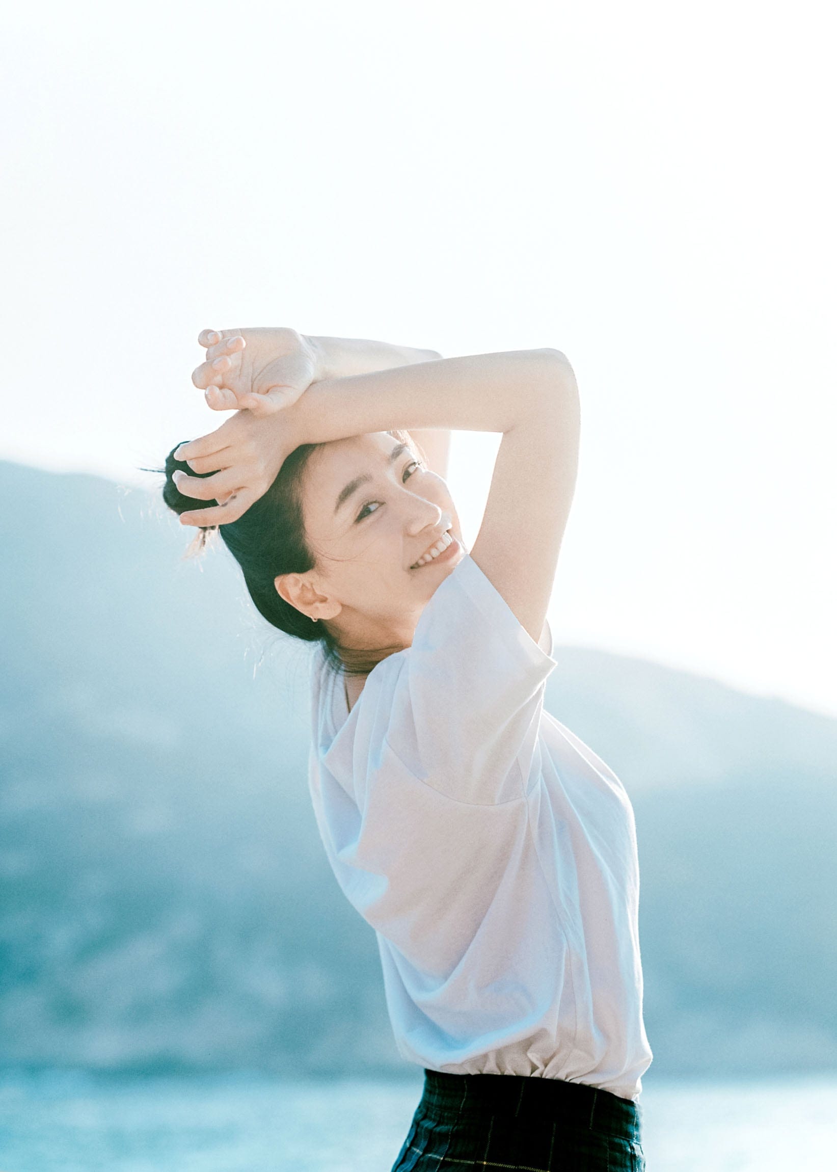 Smiling portrait in clear blue light