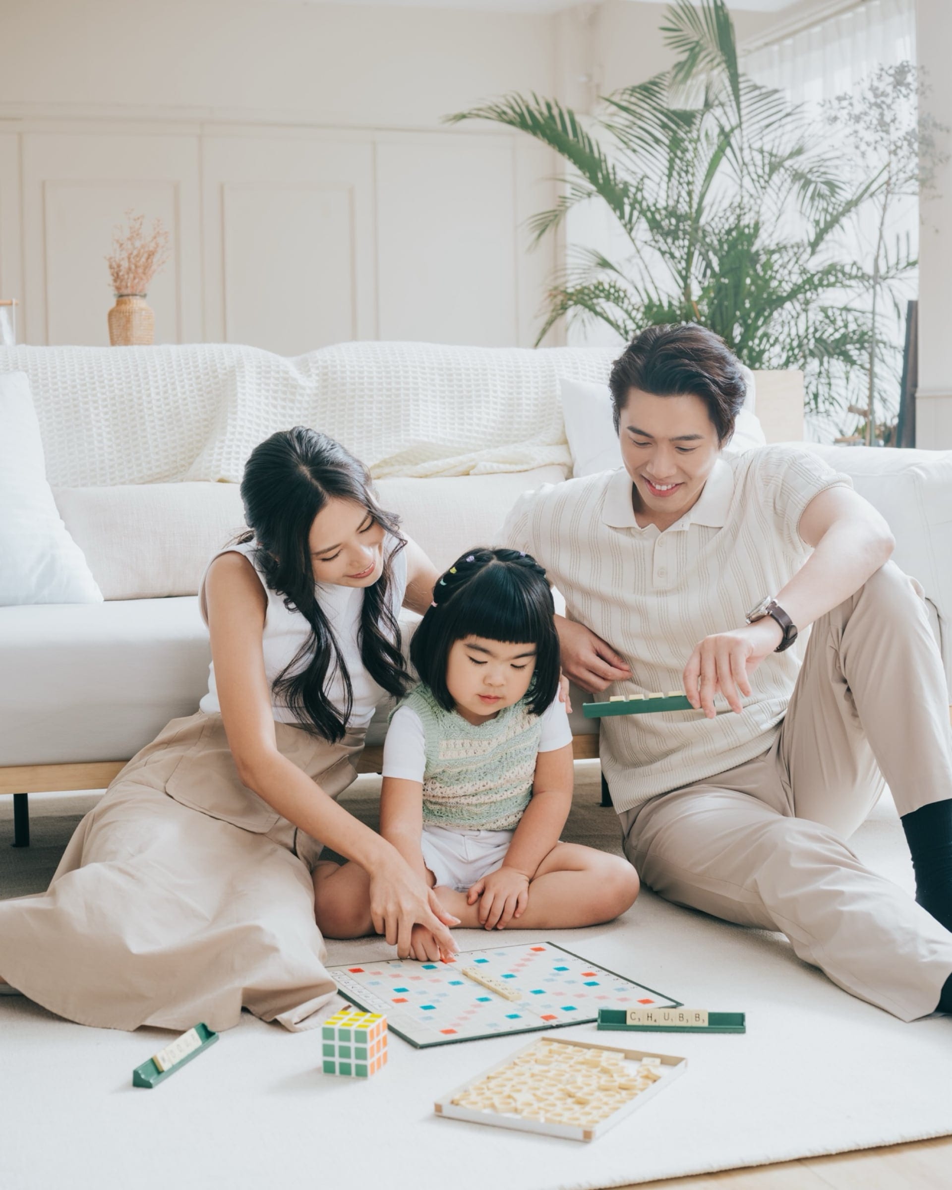 CHUBB campaign portrait of a family playing a board game