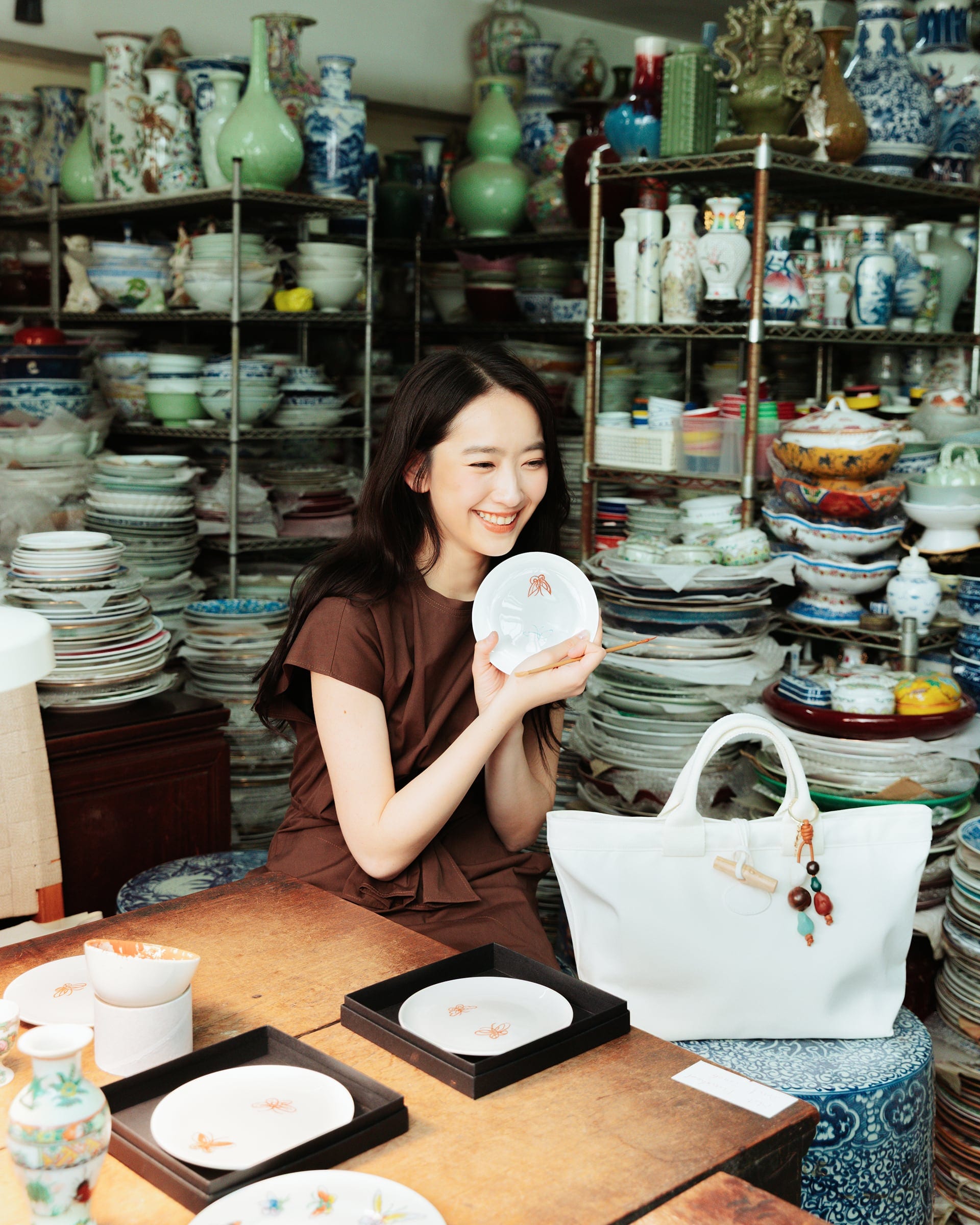 Long Champ campaign portrait of Ashley Lin in a vintage shop