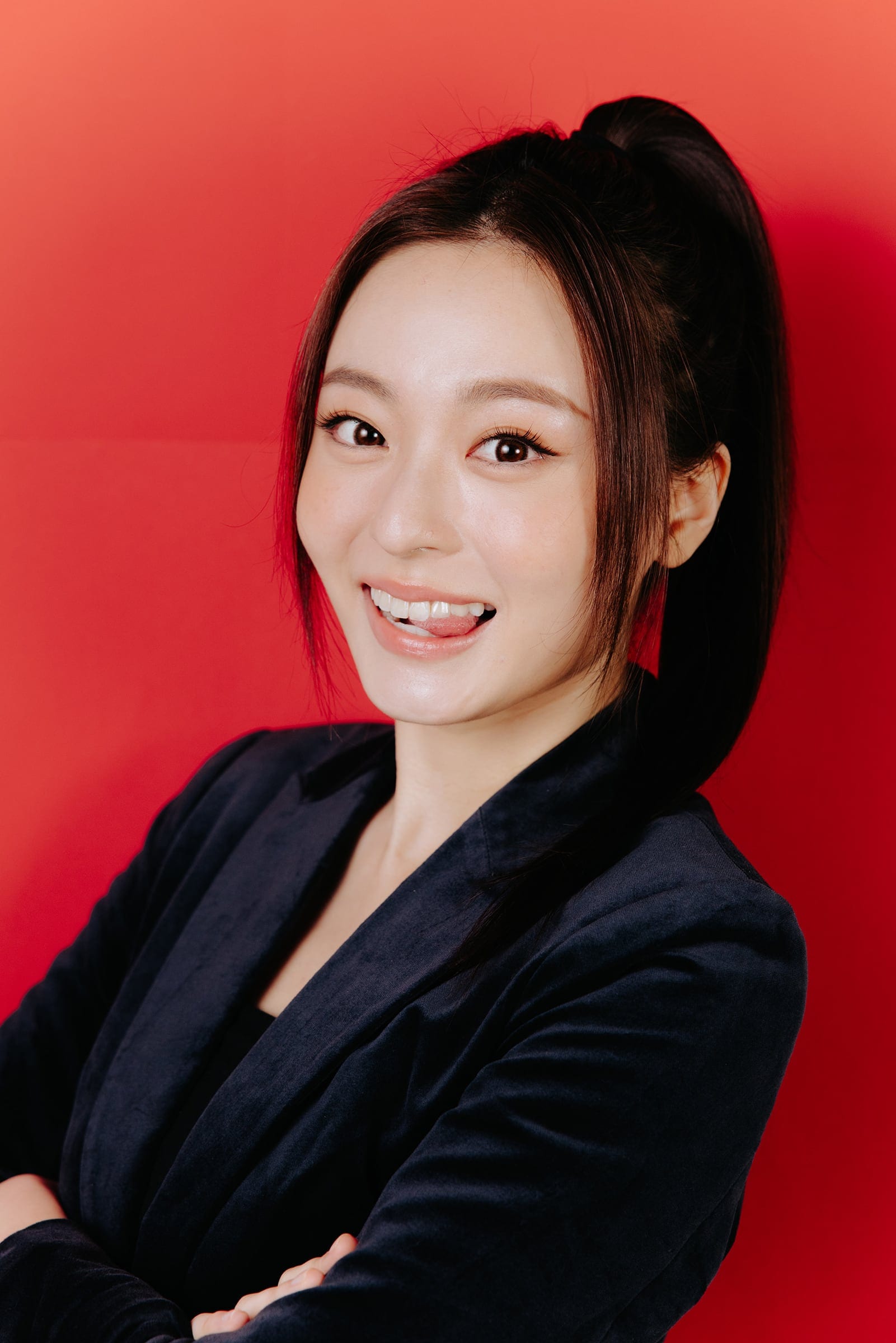 Small Roles X Lee Gardens portrait of a woman against a red backdrop