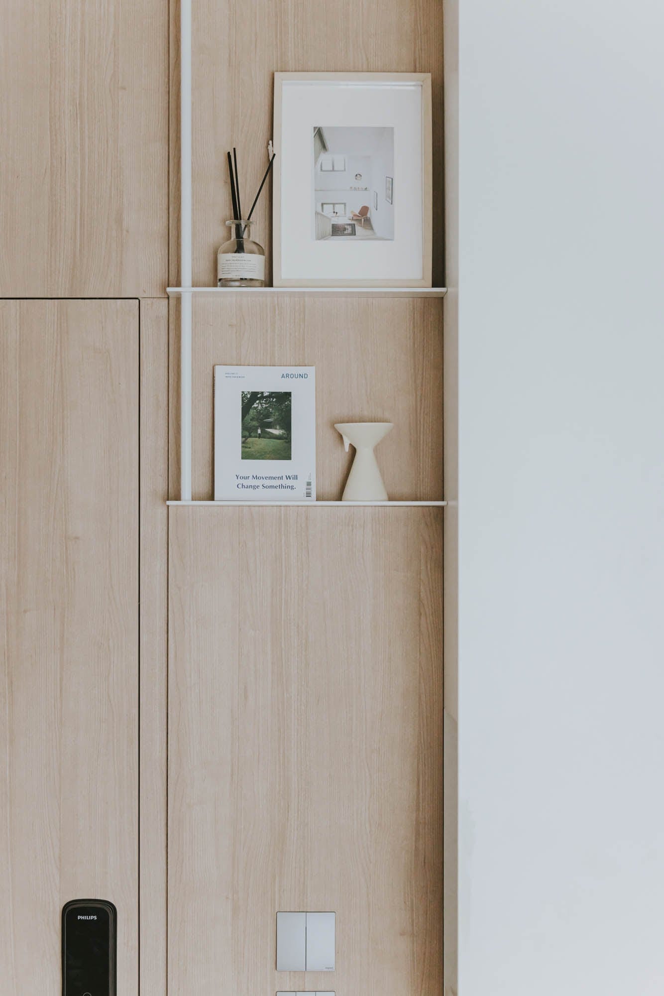 Kai Chuen Court pale timber storage with framed and sculptural details