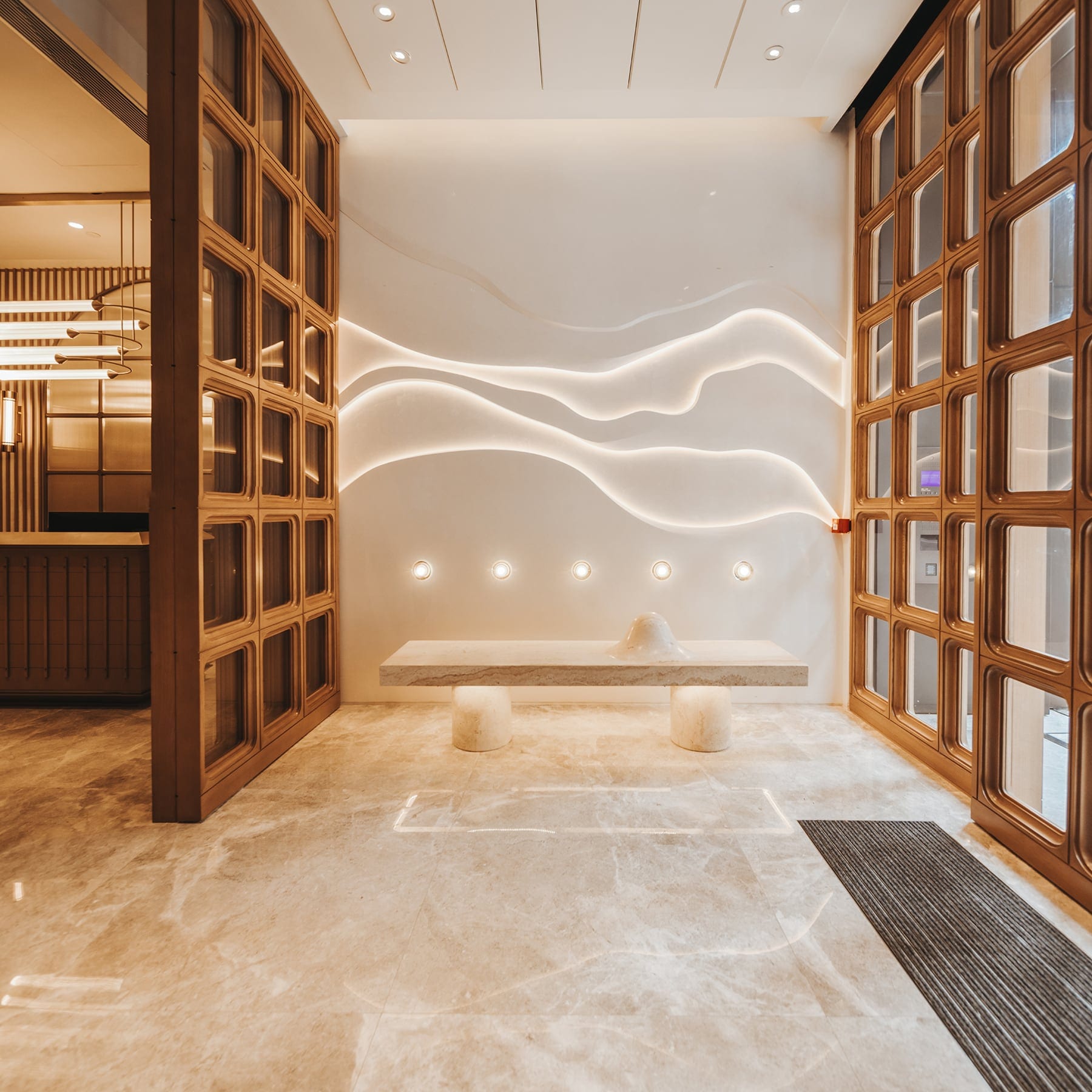 The Vantage illuminated wall and sculptural entry detail